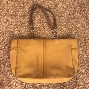 Large Coach purse with side pockets.